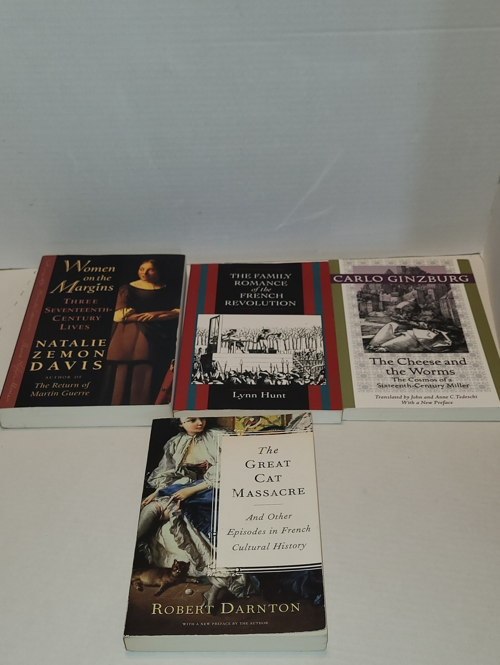 Set of Four History Books in Red, Black, White, Purple Covers